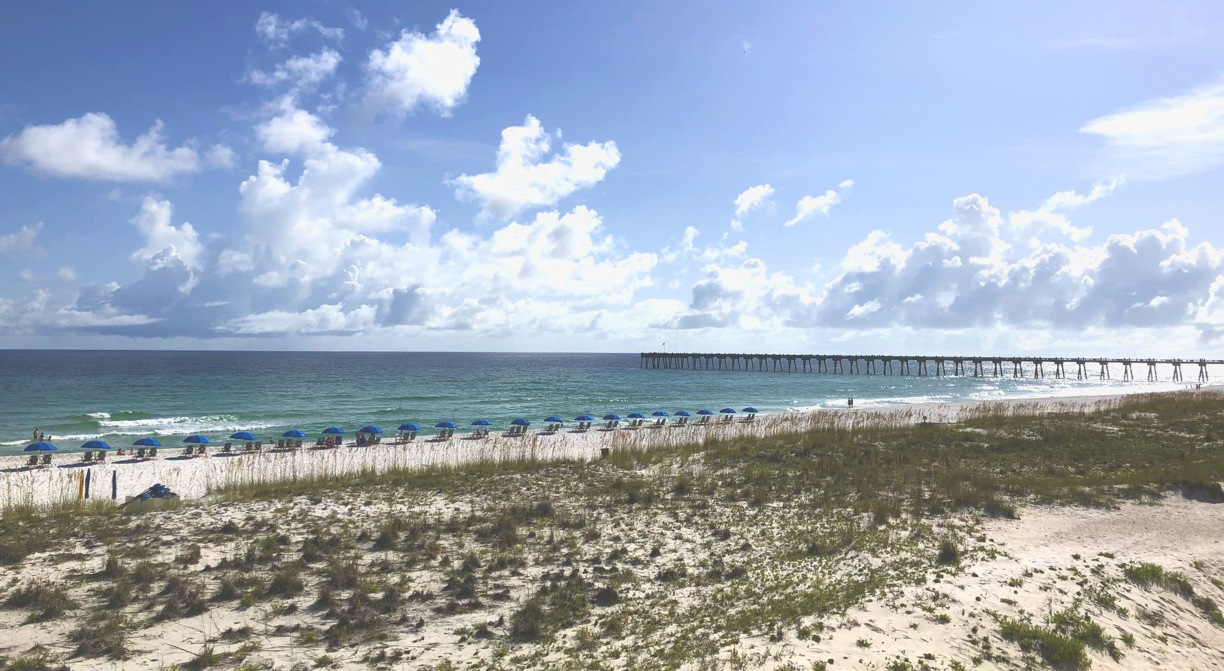 Pensacola Beach pier, dunes, and Gulf surf near Pace and Milton, FL